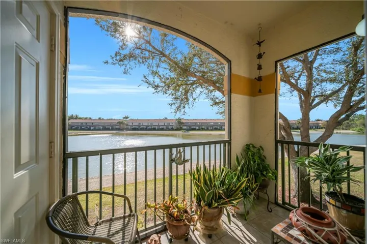 Balcony with a lake view and a sunroom