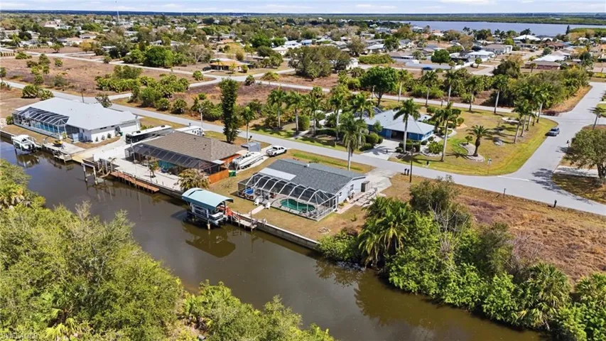 Aerial view of residential area featuring a large body of water