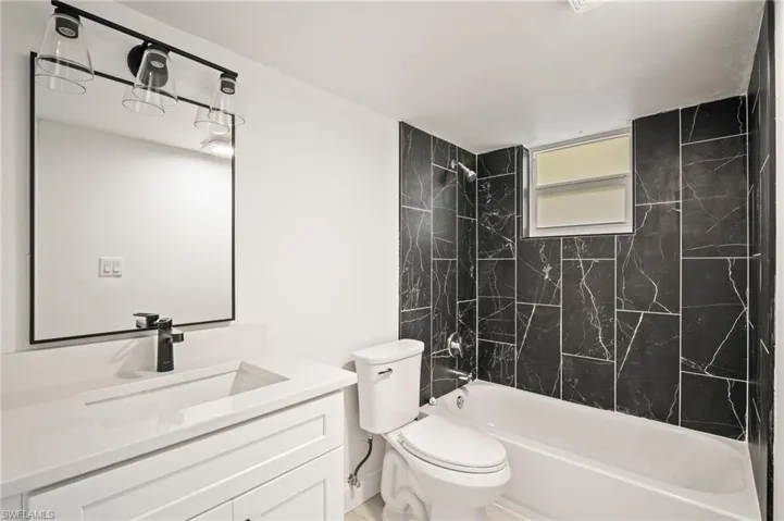 Full bathroom featuring  shower combination and vanity