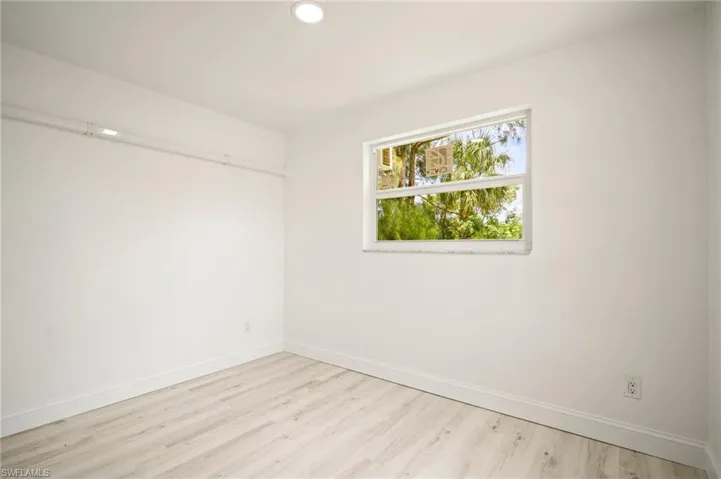 Unfurnished room with light wood-style flooring and recessed lighting