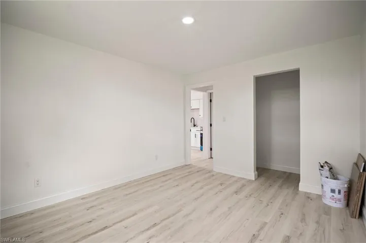 Unfurnished bedroom with light wood finished floors and recessed lighting