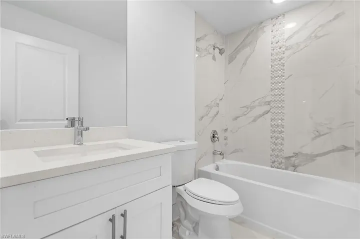 Full bath with vanity and bathtub / shower combination