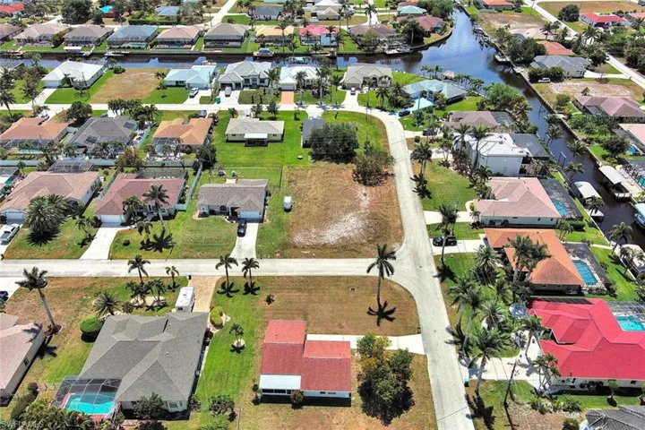 Aerial view of residential area with a nearby body of water