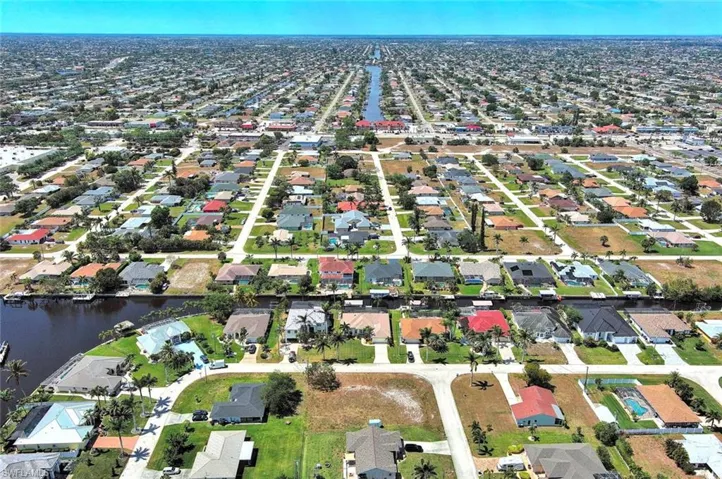 Aerial overview of property's location featuring nearby suburban area