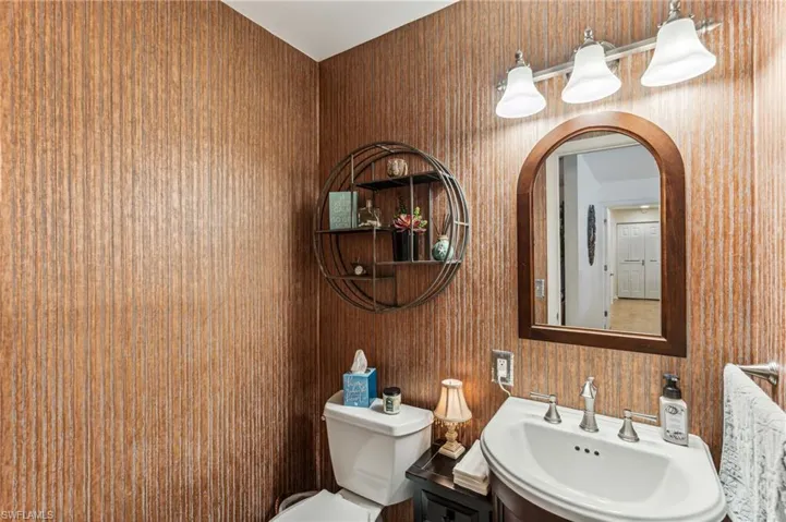Charming half bath off casual living area