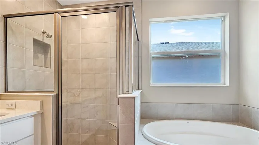 Bathroom with independent shower and bath and vanity