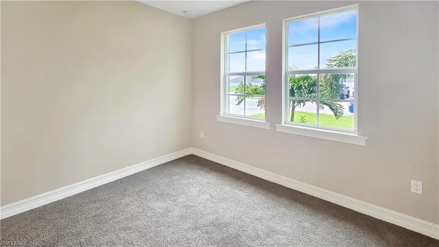 Unfurnished room featuring carpet