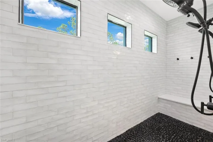 Bathroom featuring a tile shower