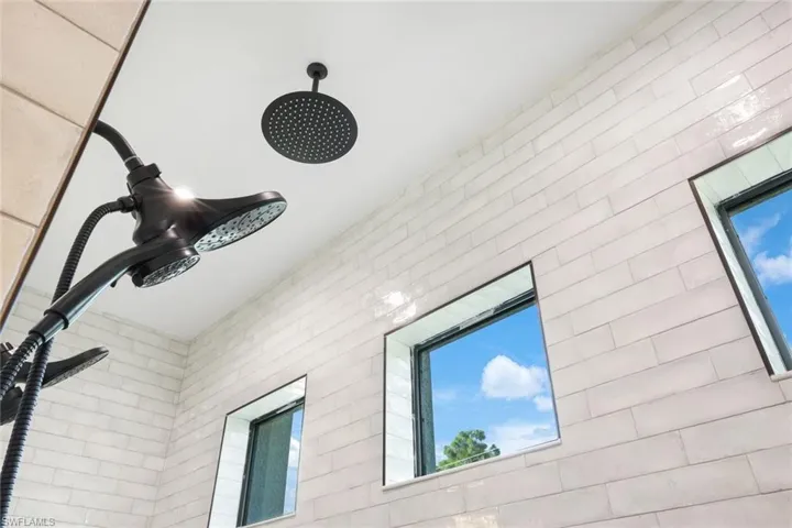 Room details featuring walk in shower