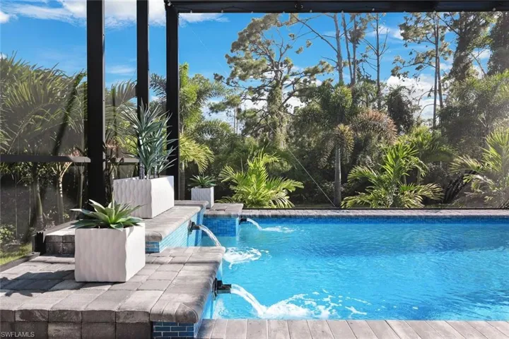 View of swimming pool featuring pool water feature