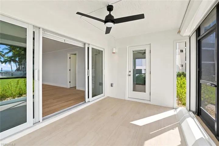 Screened in lanai with Gulf views and electric shutters -Virtually Edited Image