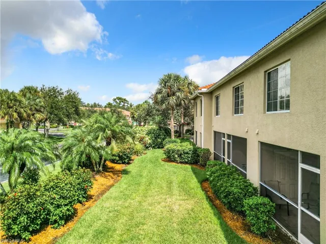 View of yard with a sunroom