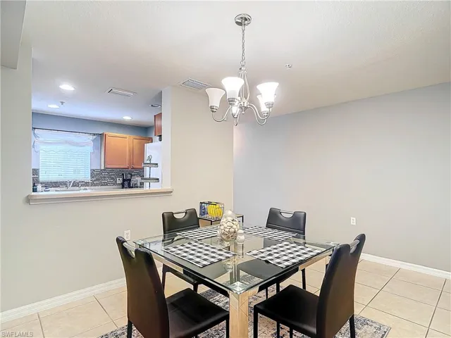 Tiled dining area with a notable chandelier