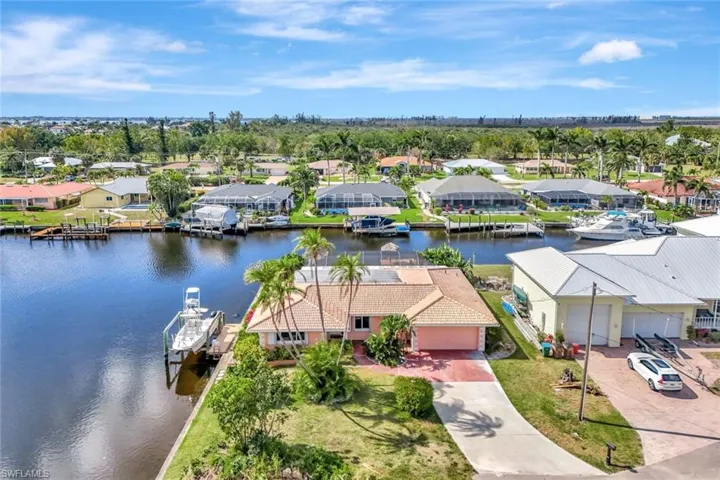 Birds eye view of property with a residential view and a water view