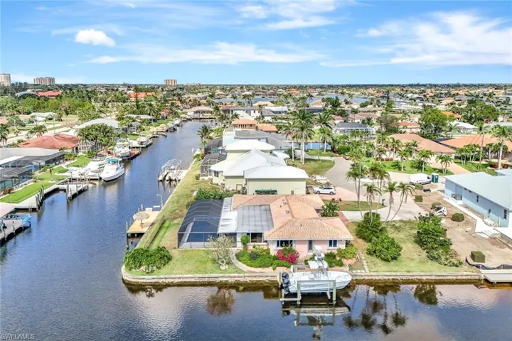 Drone / aerial view featuring a water view and a residential view