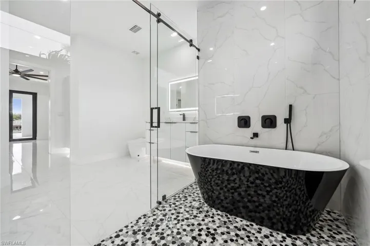 Soaking Tub right inside the shower. No wet messy floors.