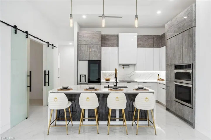 Stunning Kitchen with quartz counters, custom cabinetry and LG appliances.
