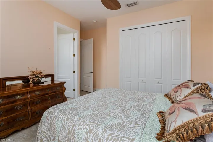Bedroom with a closet and a ceiling fan