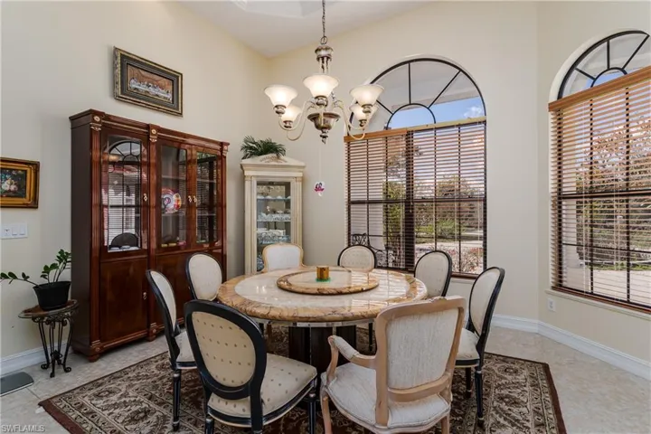 Dining space with baseboards and a chandelier