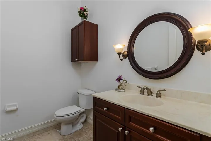 Bathroom with vanity and light tile patterned floors