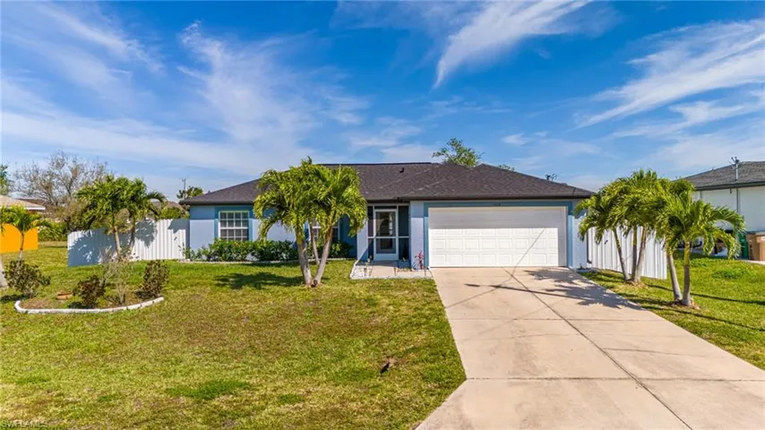 Front of home with beautiful landscaping