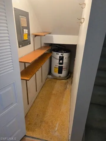 Utility room featuring electric water heater