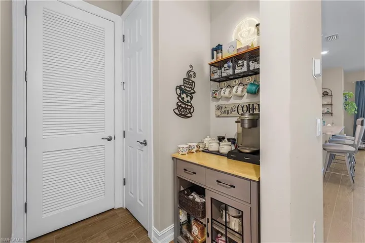Bar area featuring wood tiled floors and butcher block counters