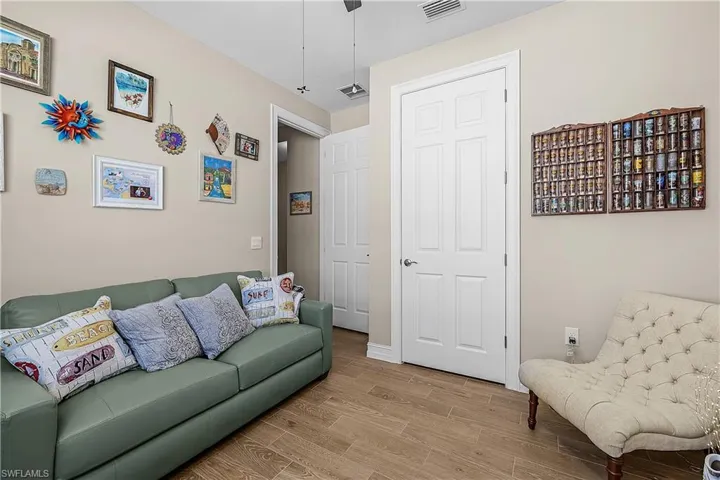 Guest Bedroom 1 featuring wood finish floors