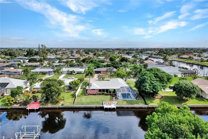 Aerial view of residential area with a nearby body of water