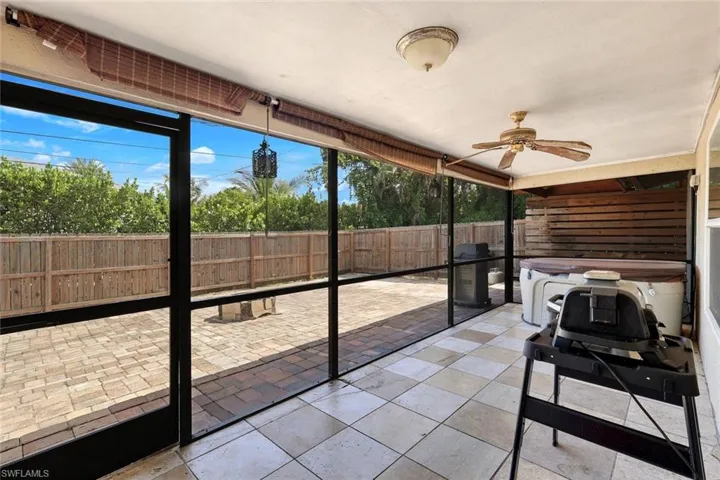 Screened lanai with portable whirlpool tub.