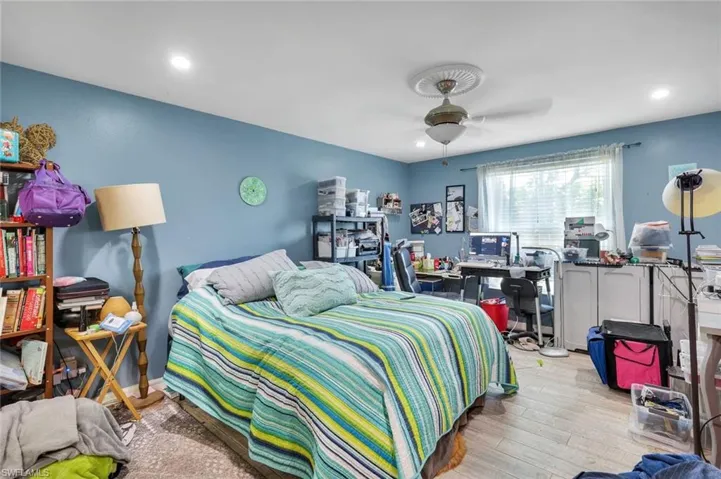 Main bedroom located on the rear of the home with walk-in closet accented with barn door.