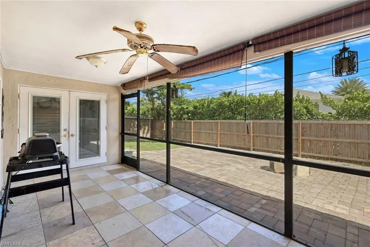 Screened lanai with French doors out family room.