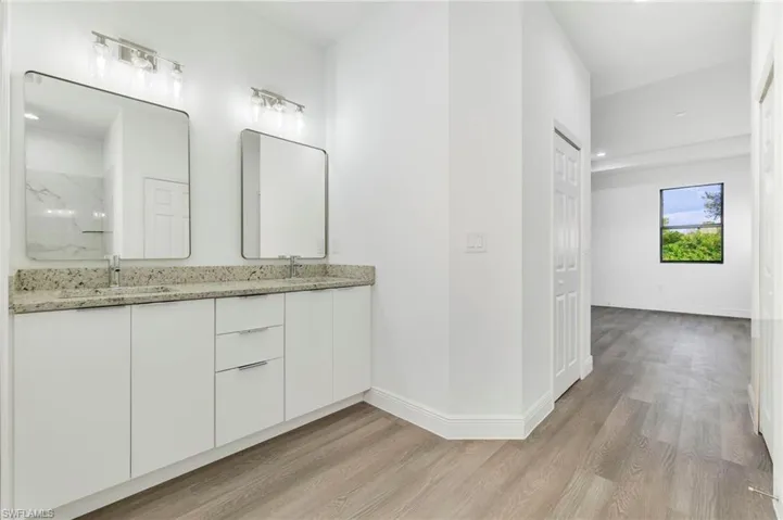 Bathroom featuring vanity and hardwood / wood-style floors