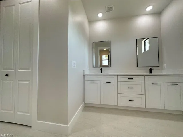 Bathroom featuring double vanity