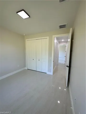 Unfurnished bedroom with a closet