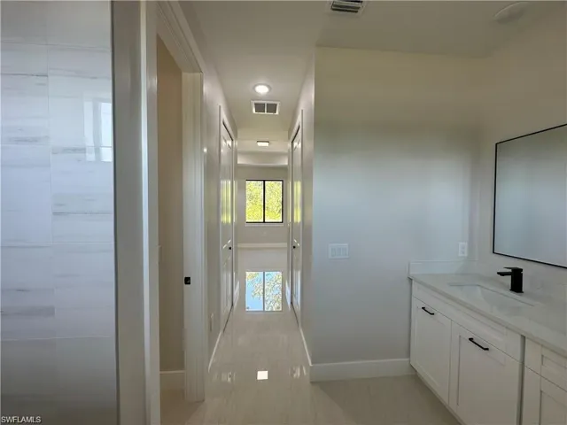 Bathroom with vanity and tile patterned flooring