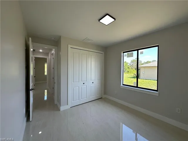 Unfurnished bedroom featuring a closet