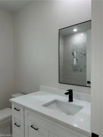 Bathroom with toilet and vanity