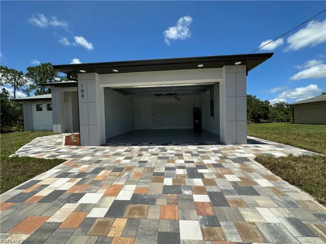 Garage with a lawn