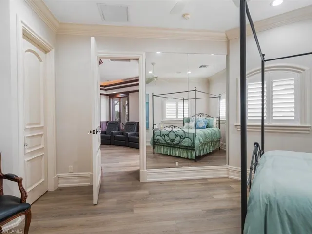 Bedroom featuring ornamental molding and light wood finished floors