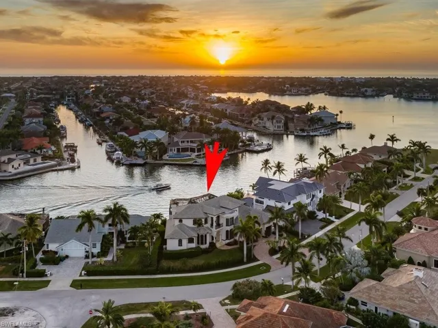 Aerial view at dusk of a water view and a residential view