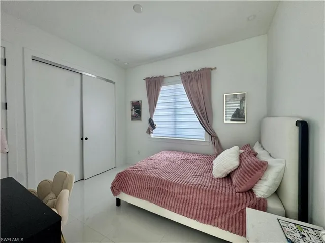 Room featuring white walls and tile flooring