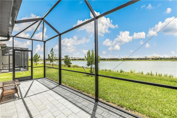 Extended screened-in patio with lake view