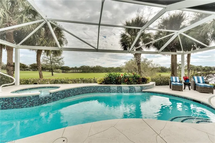 View of pool featuring a lanai, an outdoor living space, an in ground hot tub, and a patio