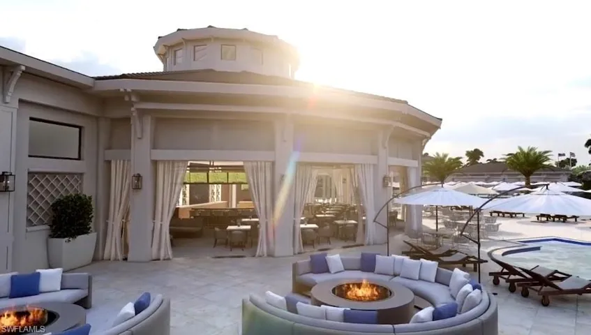 View of patio featuring an outdoor fire pit