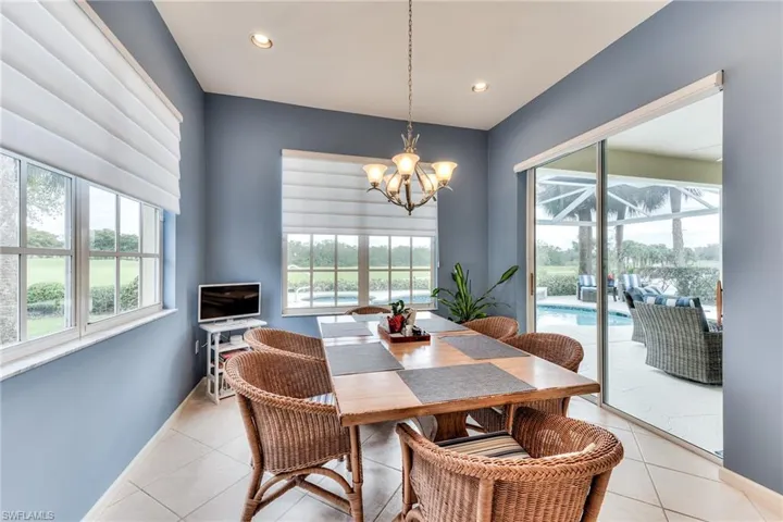 Tiled dining space with a notable chandelier