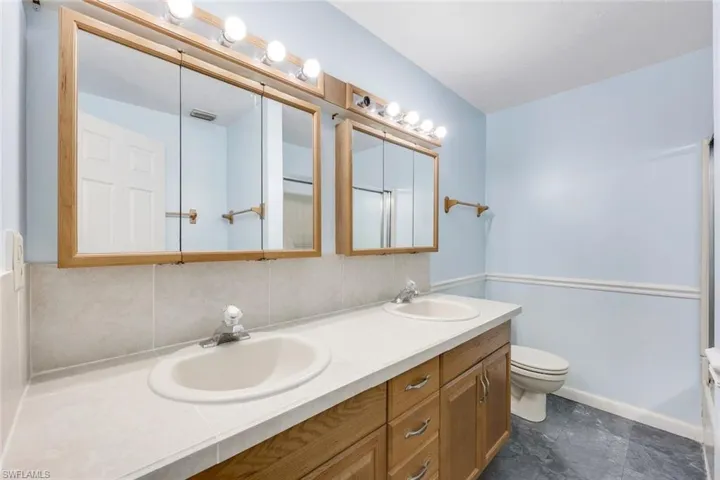 Bathroom featuring toilet and vanity