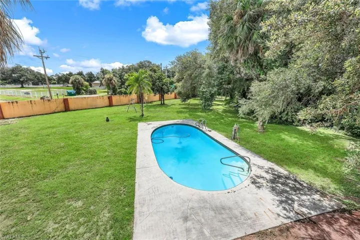 View of pool with oversized yard