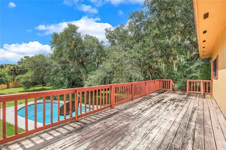 View of deck on 2nd floor from the Bonus Room with fireplace