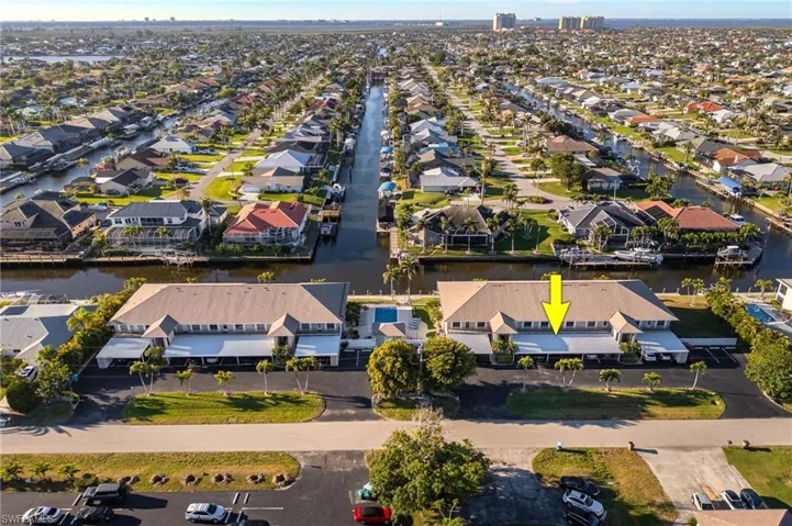 Aerial perspective of suburban area with a large body of water